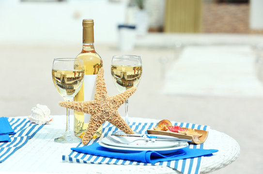 Served decorated table on sea background
