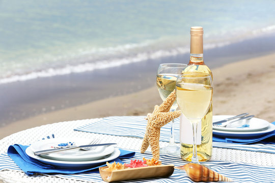 Served decorated table on sea background
