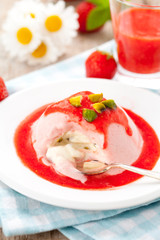 Home made strawberry ice cream with sauce