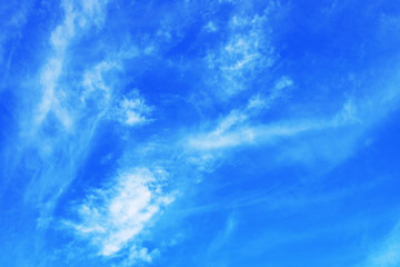 Blue sky with tiny clouds background