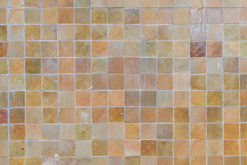 Brown concrete tile wall background and texture