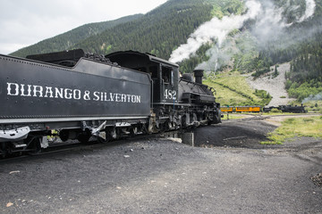 Obraz premium Two trains, Durango and Silverton Narrow Gauge Railroad featuring Steam Engine, Silverton, Colorado, USA, 07.07.2014