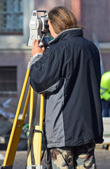 Land surveyor at the road construction