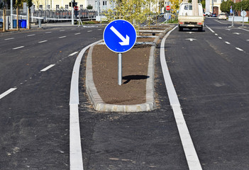 Arrow sign at the road crossing