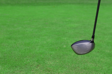 Expensive golf club on green luxury golf course, close up
