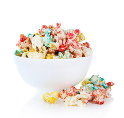 Sweet colourful popcorn isolated on white background