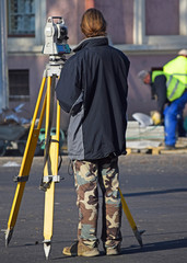 Land surveyor at the road construction