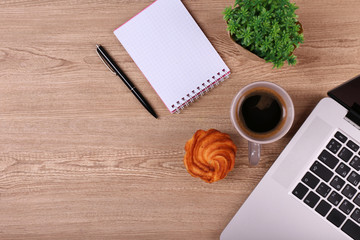 Top view of comfortable working place on wooden background