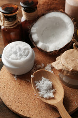 Spa coconut products on dark wooden background
