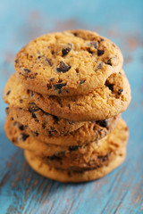Close up focus view on cookies with chocolate crumbs on blue wooden table
