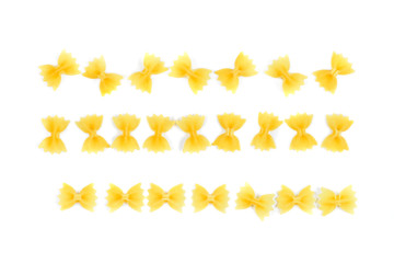 farfalle pasta arranged in a row string