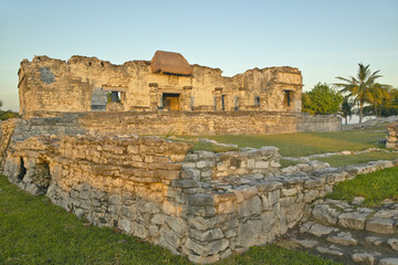 Mayan ruins of Ruinas de Tulum (Tulum Ruins) in Quintana Roo, Mexico in the Yucatan Peninsula, Mexico at sunset