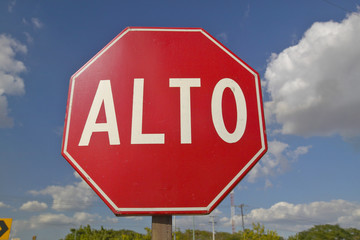 A stop sign reads Alto in the Yucatan Peninsula, Mexico
