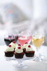 Tasting of wine and chocolate cupcakes, close up