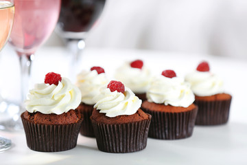 Tasting of wine and chocolate cupcakes, close up