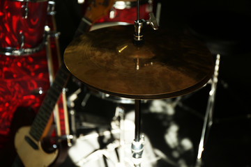 Fototapeta na wymiar Musical instruments on a stage on dark background