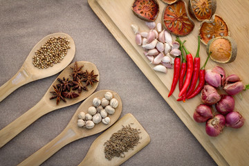 Various colorful spices on wooden table