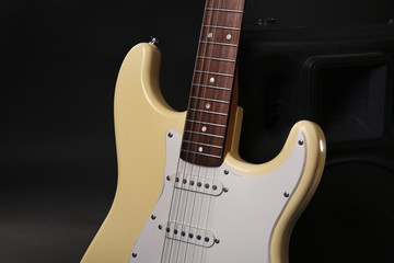 Obraz na płótnie Canvas Electric guitar with musical equipment on dark background