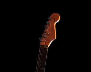 Fototapeta na wymiar Guitar's fingerboard on dark background, close up
