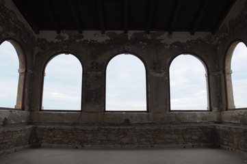 arched windows in medieval fortress on the sea coast. Novigrad
