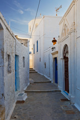 Fototapeta na wymiar Street in Plaka village, the capital of Milos island in Greece.