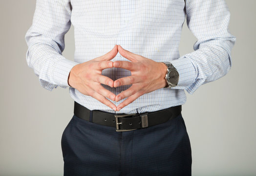 Young business man discribes some concept by gesting of his fingers.