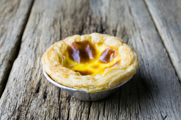 delicious portuguese egg tart on wood background