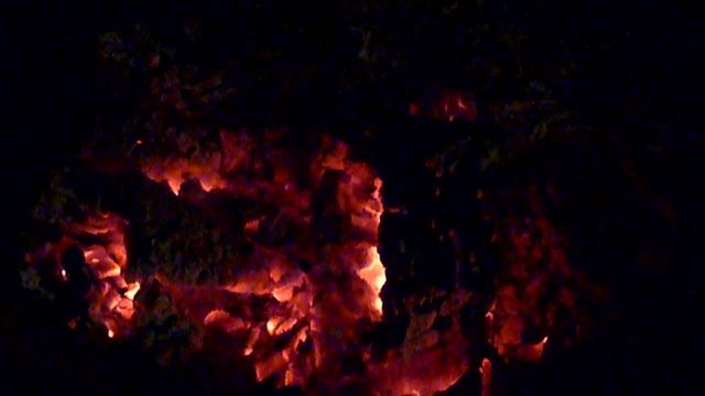fire creeping under burning ashes (slow motion)