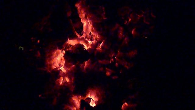fire kindling under burning ashes (slow motion)