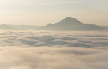 Fototapeta na wymiar Landscape of sunrise and mist in the mountain at Phu Thok.-Loei, Thailand.