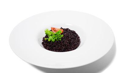 Black rice risotto with tomato.