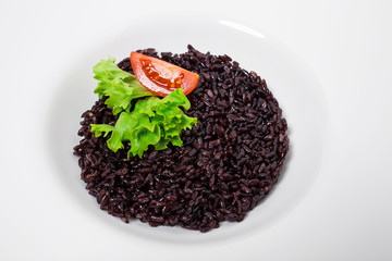 Black rice risotto with tomato.