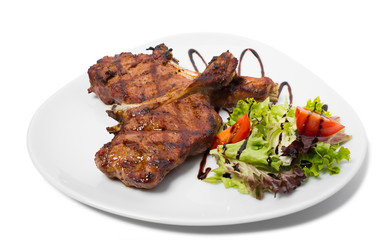 Grilled steaks with vegetables.