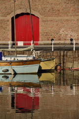 New Marina, Jersey, U.K. Telephoto image of moored boats at high tide on a calm Autumn morning.