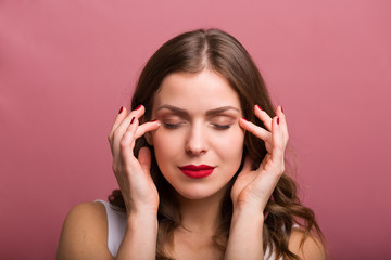 Woman applying an eye cream