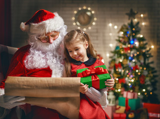 Fototapeta na wymiar Santa Claus and little girl