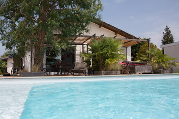 A beautiful Swimming pool with holiday house