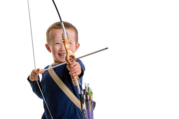 Happy 3 years old boy, holding a handmade bow with an arrow and