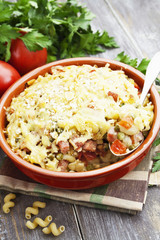 Baked pasta with bacon and green peas