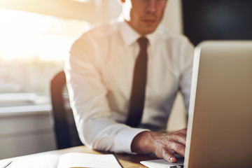 Business close up, executive working on laptop