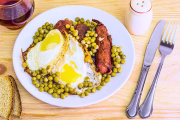 Fried eggs fried eggs with sausage and peas