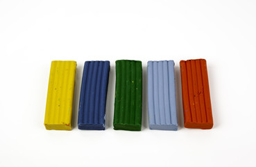  colorful plasticine blocks on white