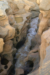 Water in ancient rocks near Tsavo National Park, Kenya, Africa
