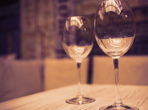 two empty glasses on a table in a cafe
