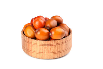 Ripe jujubes in bowl isolated on a white