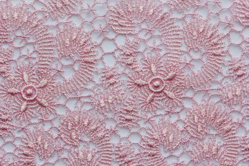 The macro shot of the pink and magenta lace texture materia