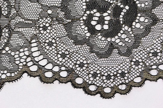 The macro shot of the black flower lace texture materia