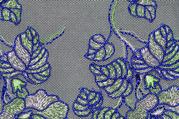 The macro shot of the green and blue lace texture material