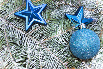 Various decorations for the Christmas and New Year, shiny toys,  stars lie on fir branches. Isolated top view