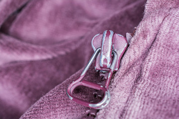 Macro Of The Front Of A Purple Used Zipper